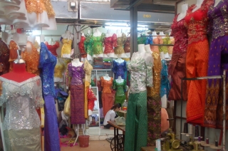 Surrounded by a throng of sequined spectres in the dressmaker's section of the market