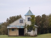 This little overgrown chapel is set on a tiny island in a bay