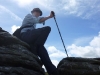 Stewart atop a tor