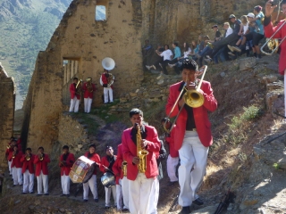 A brass band in bright red jackets - just what you expect to find at 8am on an Inca ruin half-way up a mountain