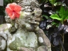 The humid tropical climate rapidly gives stonework a patina of age. This nattily decorated fellow may only be a few years old