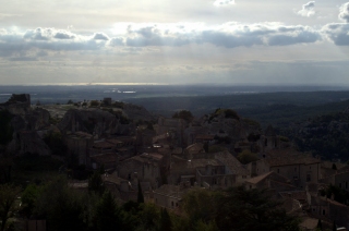Les Baux huddled beneath its citadel, the flat Camargue beyond